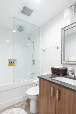 a bathroom with a toilet and a glass shower at Whistler Studio by Gondola & Free Parking in Whistler