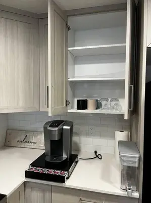 a kitchen with a coffee maker on a counter at Brand New - Home Away from Home in NW Calgary in Calgary