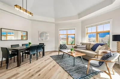 a living room with a couch and a table at The Grand Escape Downtown Canmore in Canmore