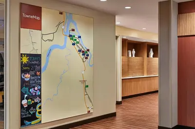 a map on a wall in a hospital hallway at TownePlace Suites by Marriott Fort McMurray in Fort McMurray