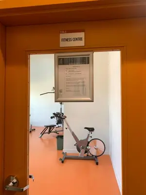 a gym with two exercise bikes in a room at UC Stampede Condo by Train, Hospital, free UG parking & Gym, AC, full kitchen in Calgary