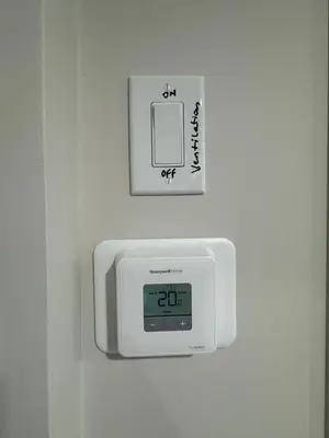 a clock on a wall with a clock on it at Brand new 2 Bedrooms modern guest suite with separate entrance in Calgary