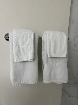 two towels hanging on a towel rack in a bathroom at Brand new 2 Bedrooms modern guest suite with separate entrance in Calgary