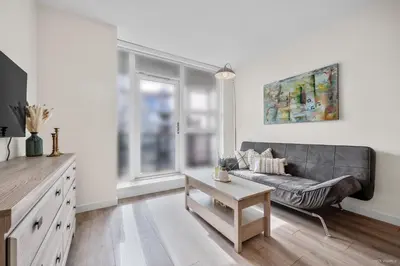 a living room with a couch and a window at Stylish and Tranquil Retreat in Richmond City Center in Richmond