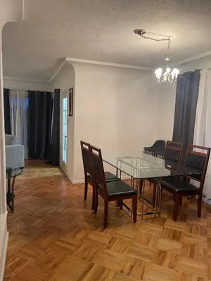 a dining room with a glass table and chairs at Home in West Vancouver in West Vancouver