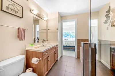a bathroom with a sink and a shower at Top Floor Lakeview Condo at Copper Sky 509 in West Kelowna