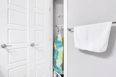 a white door with a tie and a towel at Your Happy Place Seton3 bed. Sleeps 6. 2.5bath in Calgary