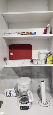 a kitchen counter with a blender on a shelf at Cozy One bedroom BSMT Apartment in Edmonton