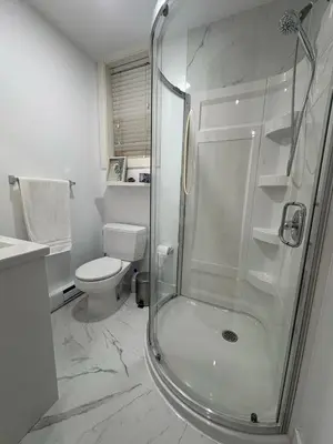 a bathroom with a shower and a toilet at Guest room with private bath in Langford in Victoria