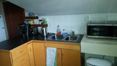 a kitchen with a sink and a microwave at Bon Homme View in Jasper