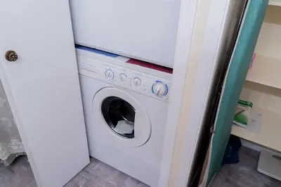 a white washer and dryer in a kitchen at Cozy Red Deer Suite for 3 in Red Deer
