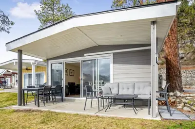 a pavilion with chairs and tables on a patio at Family-friendly Cottage with amazing views in West Kelowna