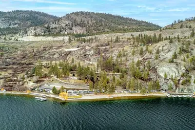 an aerial view of a island in the water at The Lakeside Condo #202 in West Kelowna