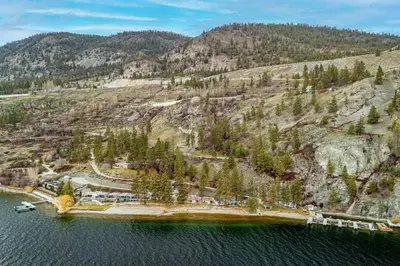 an aerial view of a resort in the middle of a lake at Beautiful Cabin Right next to Lake Okanagan #5 in West Kelowna