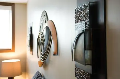 a wall with several pieces of art on it at YEG Chic Luxury Accommodation in Edmonton