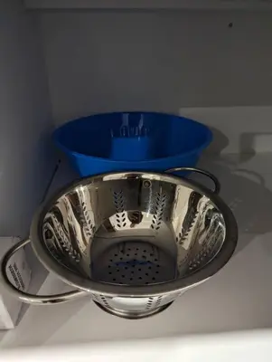 a bowl on a counter with a blue bowl at The Fruitful Vineyard- A Beautiful 2 Bed Suite in Calgary