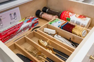 a drawer filled with wooden drawers in a drawer at Elegant & Luxury 2 Bed Suite Close to Convention Centre in Vancouver