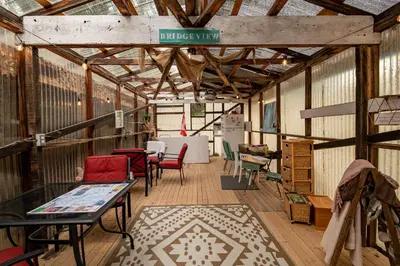 a large room with chairs and tables in a barn at #Y3 Willow Tree Yurt in Drumheller