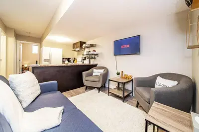 a living room with a couch and two chairs at Bright Modern Suite - Netflix - WiFi - Long Stays in Edmonton