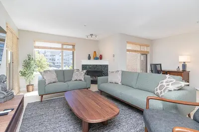 a living room with two couches and a coffee table at Harbour Retreat in Victoria