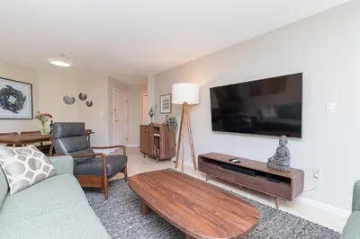 a living room with a couch and a tv at Harbour Retreat in Victoria