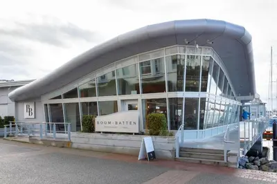 a large glass building with a sign in front of it at Harbour Retreat in Victoria