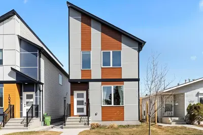 a house with wood accents on the side of it at Stylish Suite-NearWEM-4 Bed-Central in Edmonton