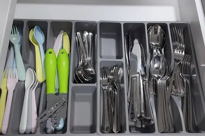 a drawer filled with utensils and forks and spoons at Cozy 2-Bedroom Basement Guest Suite with Private Entrance and Proximity to the Airport in Edmonton