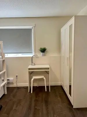 a desk with a chair in a room with a window at Beautiful home with one acre land for leisure time in Vancouver Island in Nanaimo