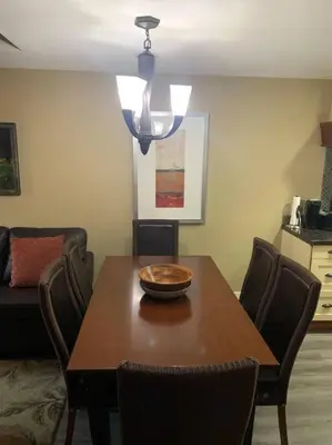 a dining room table with chairs and a bowl on top at Gracie's Place Business license 11787 in Canmore