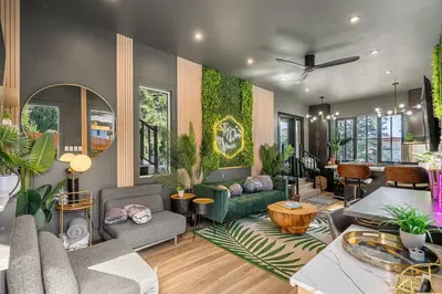 a living room filled with furniture and plants at Dome House YYC, Iconic, Luxury, Backyard Oasis in Calgary