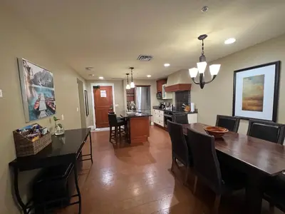 a kitchen and dining room with a table and chairs at Luxury Resort 2Bedroom 2Bath Sleeps 6 945 square feet in Canmore