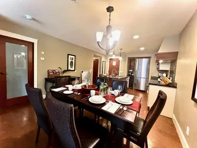 a dining room and kitchen with a table and chairs at Luxury Resort 2Bedroom 2Bath Sleeps 6 945 square feet in Canmore