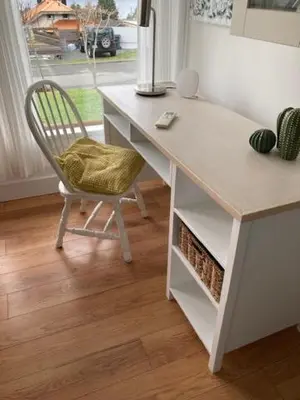 a desk with a chair in a room with a window at Rent My Studio in Powell River