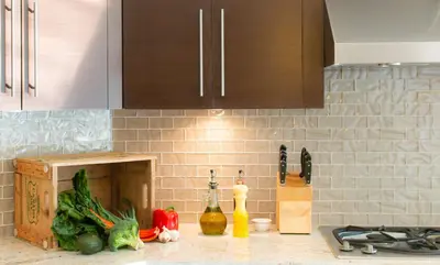 a kitchen counter with vegetables on a counter top at Welcome Home in North Vancouver