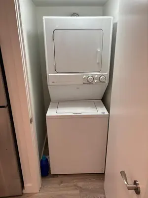 a microwave sitting on top of a small refrigerator at Large 2 bedroom private suite ! in North Vancouver