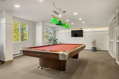 a billiard room with a pool table in it at Prime Location Near Jasper Ave with Downtown Views, Netflix, Gym, Sauna, Sleeps 4 in Edmonton