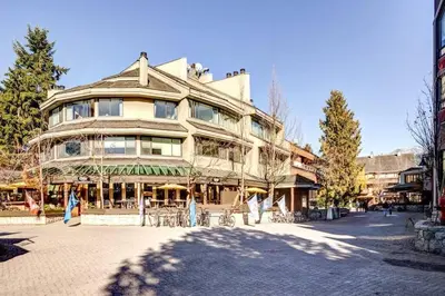 a large building on the side of a street at 1Bd Unit In the heart of Whistler Village in Whistler