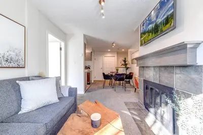 a living room with a couch and a fireplace at 1Bd Unit In the heart of Whistler Village in Whistler