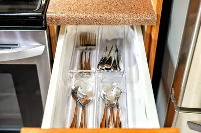 a drawer with spoons and forks and spoons at Comfy Getaway - Walk to West Ed Mall in Edmonton