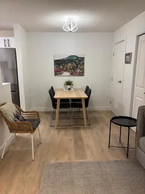 a living room with a table and chairs at Cozy Townhouse in Whistler Village North in Whistler