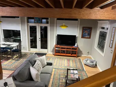 a living room with a couch and a television at Along the Way in Youbou