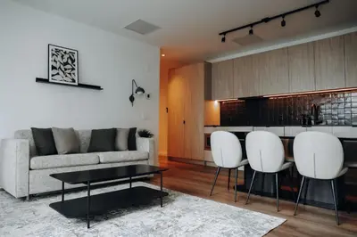 a living room with a couch and a table and chairs at Smithe House in Vancouver