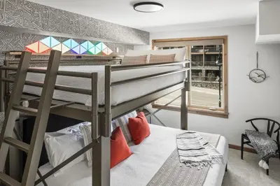a bunk bed in a room with a bunk beduteneway at New Spacious Mountain View Condo in Canmore With Hot Tub, Park Pass, Prime Location in Canmore