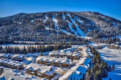 an aerial view of a resort in the snow at Settlers Crossing #35 condo in Sun Peaks