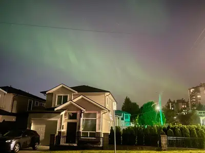 a house with a green light in front of it at Two Bedroom Suite Burnaby Metrotown in Burnaby