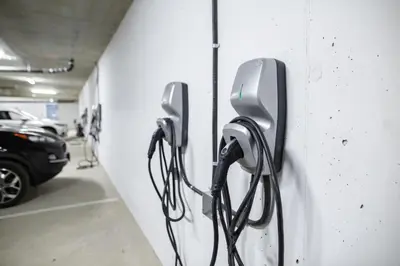 two phones hanging on a wall in a parking garage at New 1 Bed Condo with Mtn Views in Harrison Hot Springs