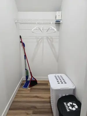 a room with a broom and a mop in a room at Cozy 2 bedrooms and 1 bath for 4 guests! in Calgary