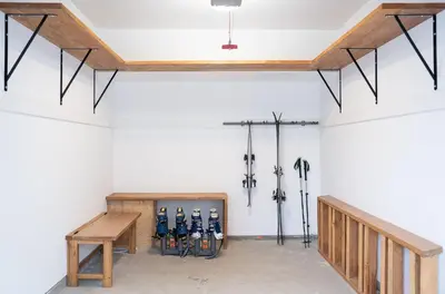 a room with skis on the wall and a bench at L'Austin Rêve by Revelstoke Vacations in Revelstoke