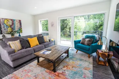 a living room with a couch and a coffee table at L'Austin Rêve by Revelstoke Vacations in Revelstoke